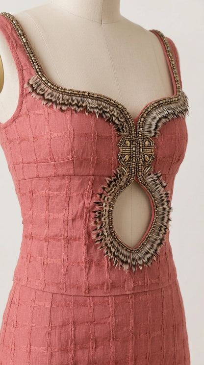 Close-up of beaded and fringed embroidery detailing along the neckline and keyhole cutout