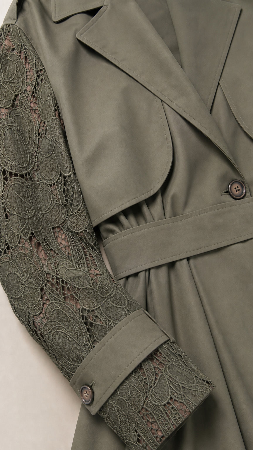 Close-up detail of Olive Green floral lace sleeve and trench storm flap