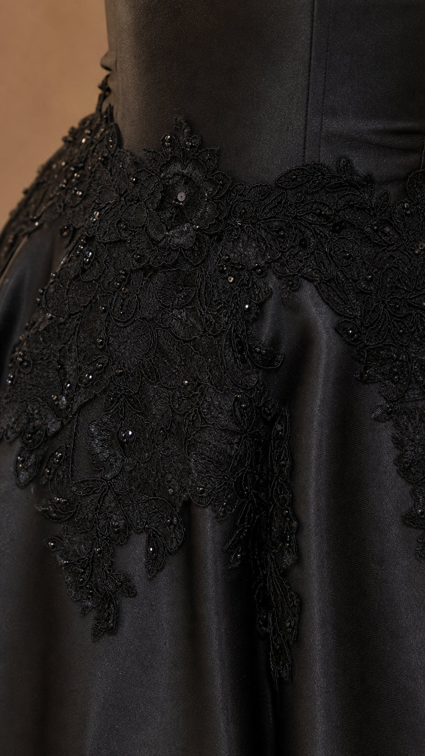 Close-up of beaded floral lace embroidery on satin bodice