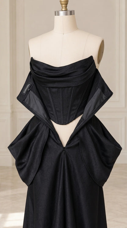 Mannequin showing inner corset boning and bodice construction of black satin gown