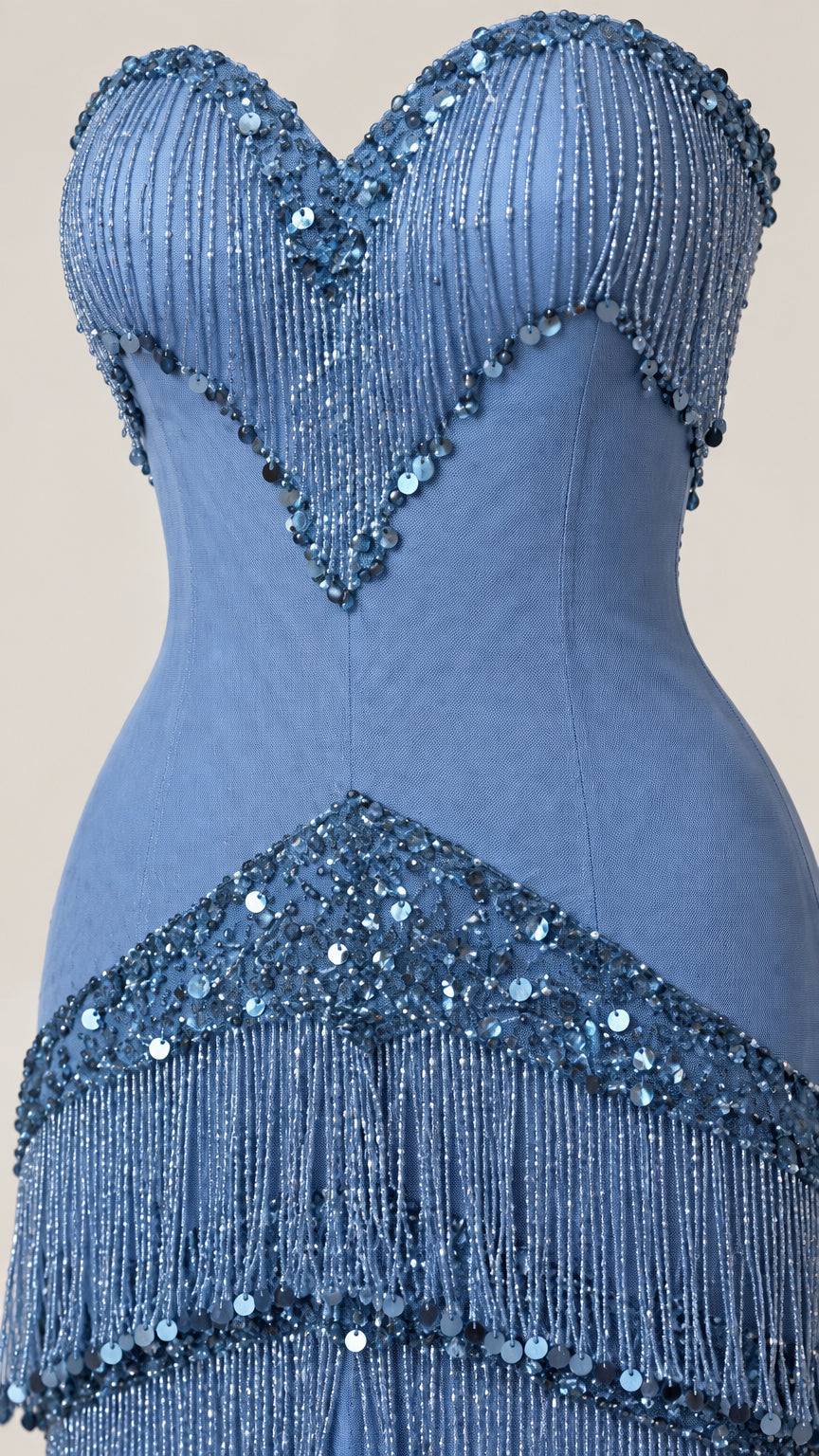 Close-up detail of embellished sweetheart neckline and tiered sequin fringe