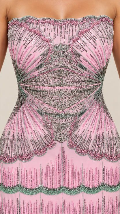 Close-up detail of intricate beadwork and sequins on pink strapless bodice