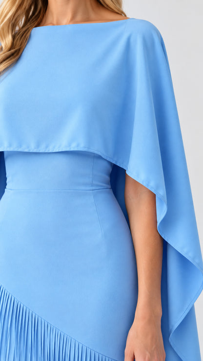 Close up detail of sky blue boat neckline and tailored cape overlay