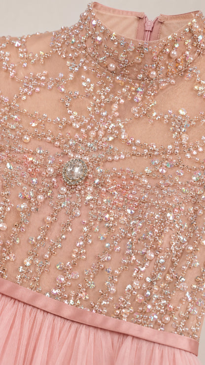 Close-up of intricate crystal and pearl beadwork on high neck bodice