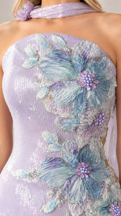 Close-up detail of 3D floral appliqué and beadwork on lavender sequin gown
