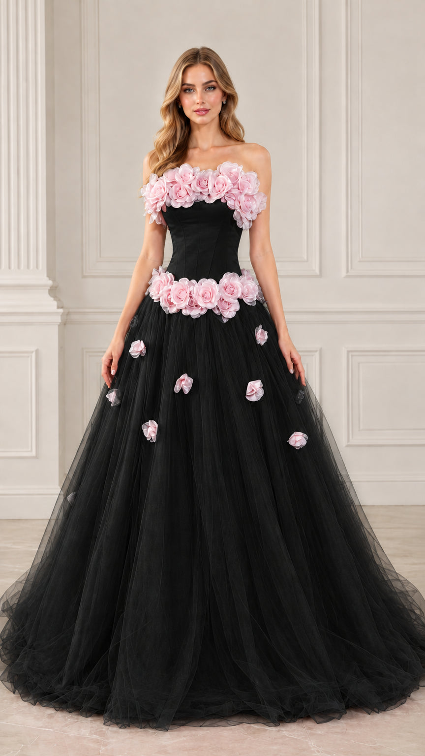 Full front view of black strapless tulle ball gown with contrasting pink 3D rosettes