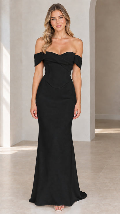 Woman wearing black off-the-shoulder corset maxi evening dress