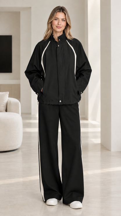 Black and white colorblock two-piece tracksuit set on model