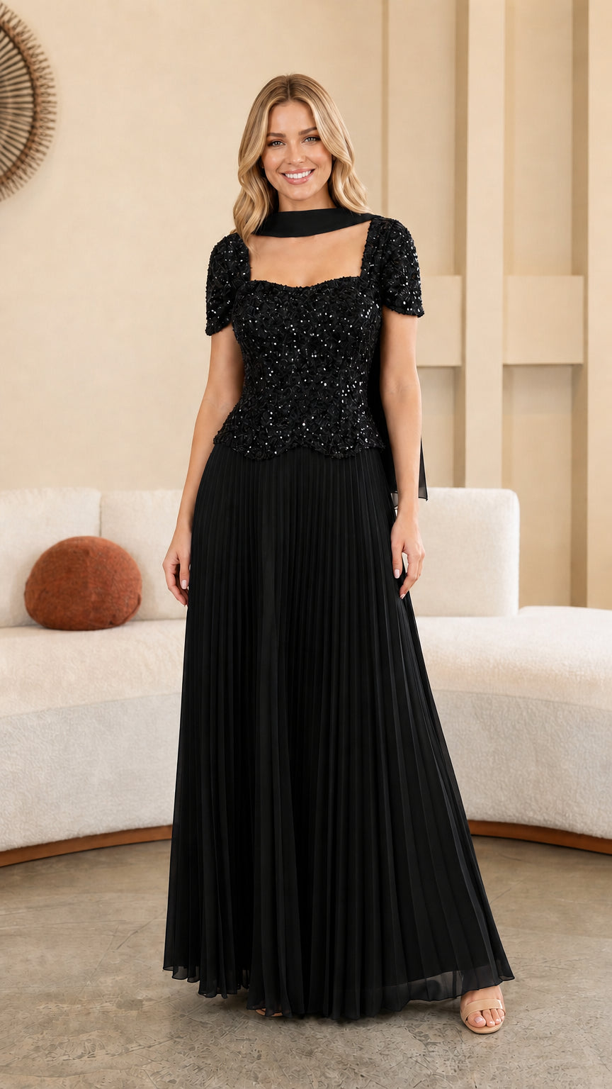 Model wearing Black sequined bodice pleated maxi evening gown