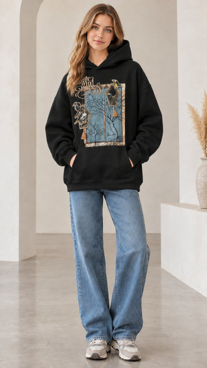 Front view of woman wearing black vintage nature bird graphic hoodie