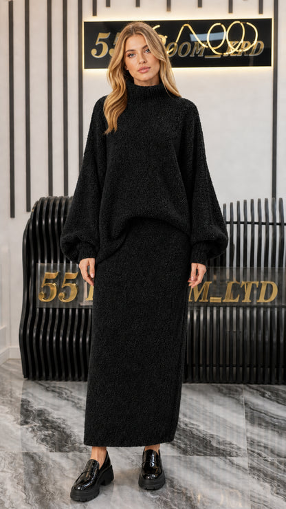 Model wearing Black mock neck lantern sleeve sweater and matching maxi skirt set