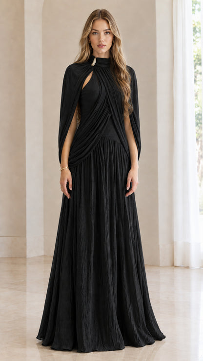 Front full-length view of woman wearing black pleated cape-sleeve maxi evening dress