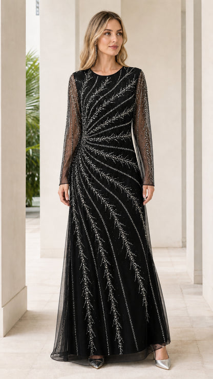Woman wearing black long sleeve beaded evening maxi dress