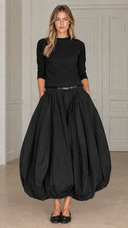 Full front view of women's monochrome two-piece bubble skirt set in black