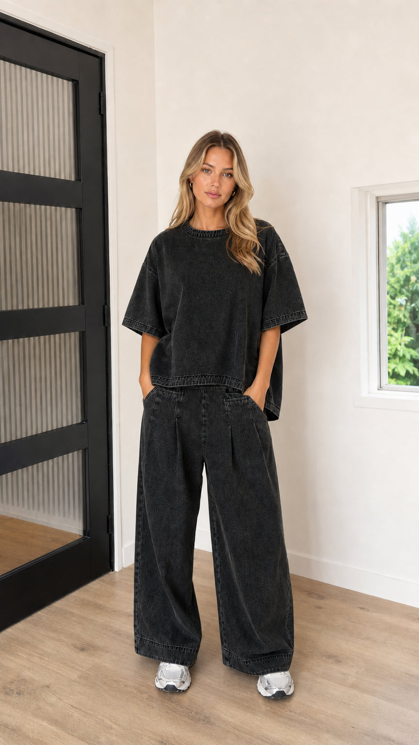 Model wearing Washed Black oversized vintage-wash tee and wide-leg pants two-piece set