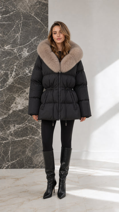 Full-body view of model wearing black quilted fur-collar puffer jacket with black boots