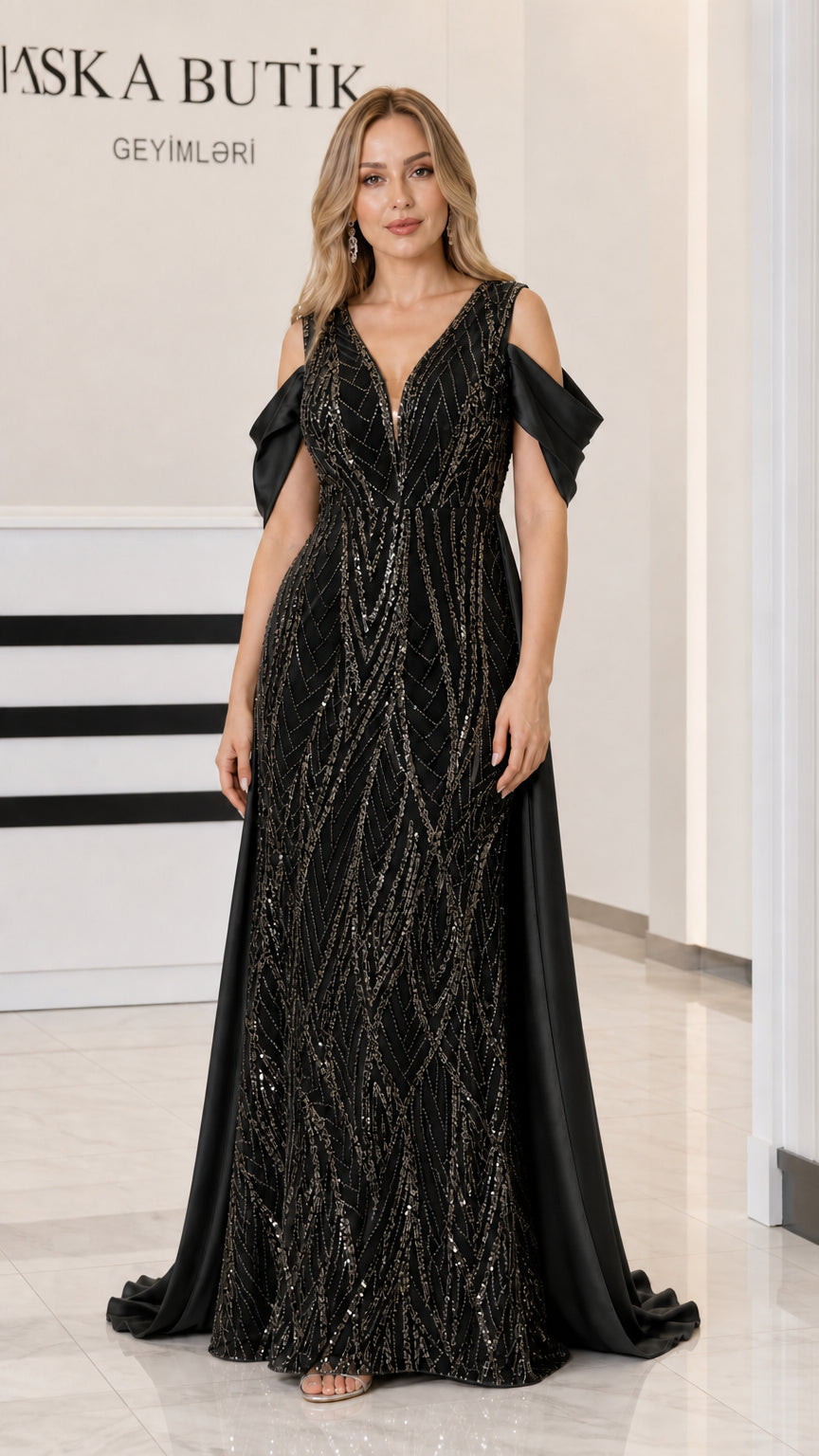 Front view of Black sequin evening gown with cold-shoulder sleeve accents