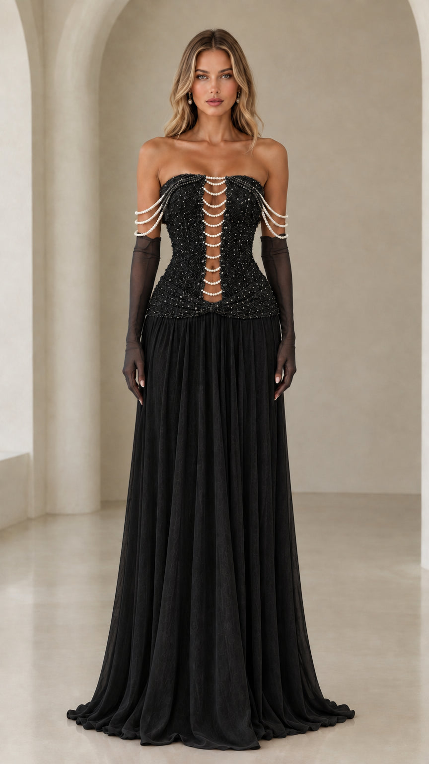 Model wearing black strapless pearl corset evening gown with black sheer gloves