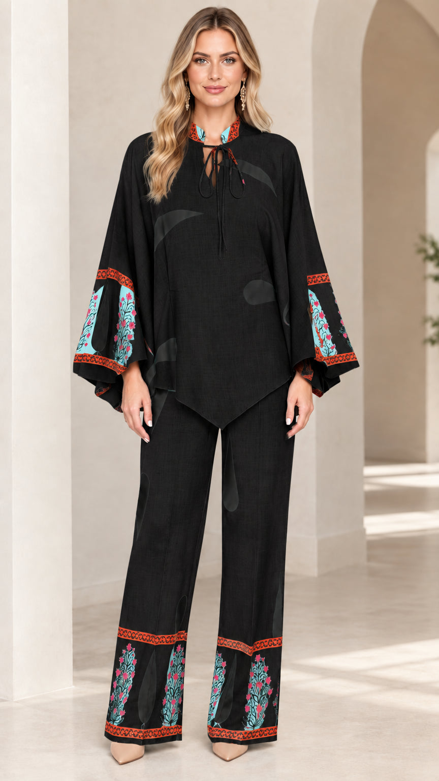 Front view of women's black printed tunic and wide-leg pants two-piece set