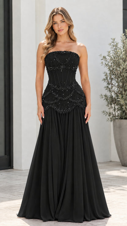 Model wearing Black strapless beaded corset drop-waist formal evening dress