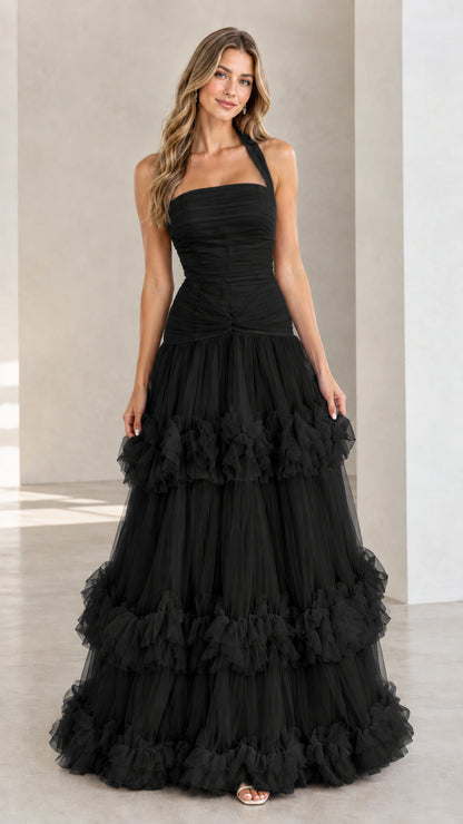 Front view of woman wearing Black halter neck tiered tulle maxi evening dress