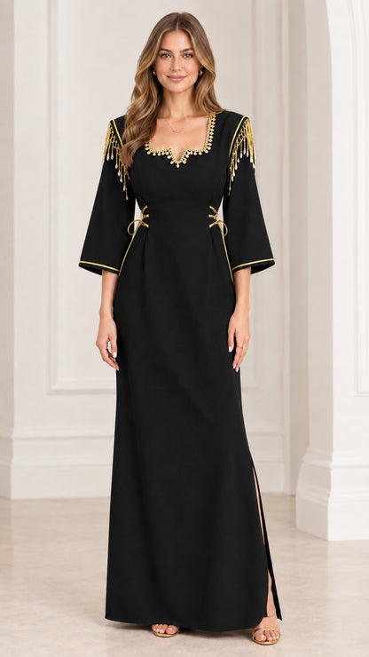 Full-length view of black maxi dress with golden shoulder tassels and trim