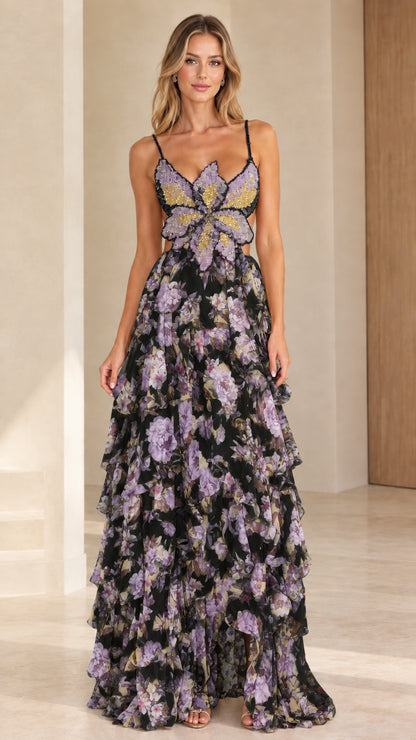 Front view of model wearing black floral butterfly beaded tiered maxi dress