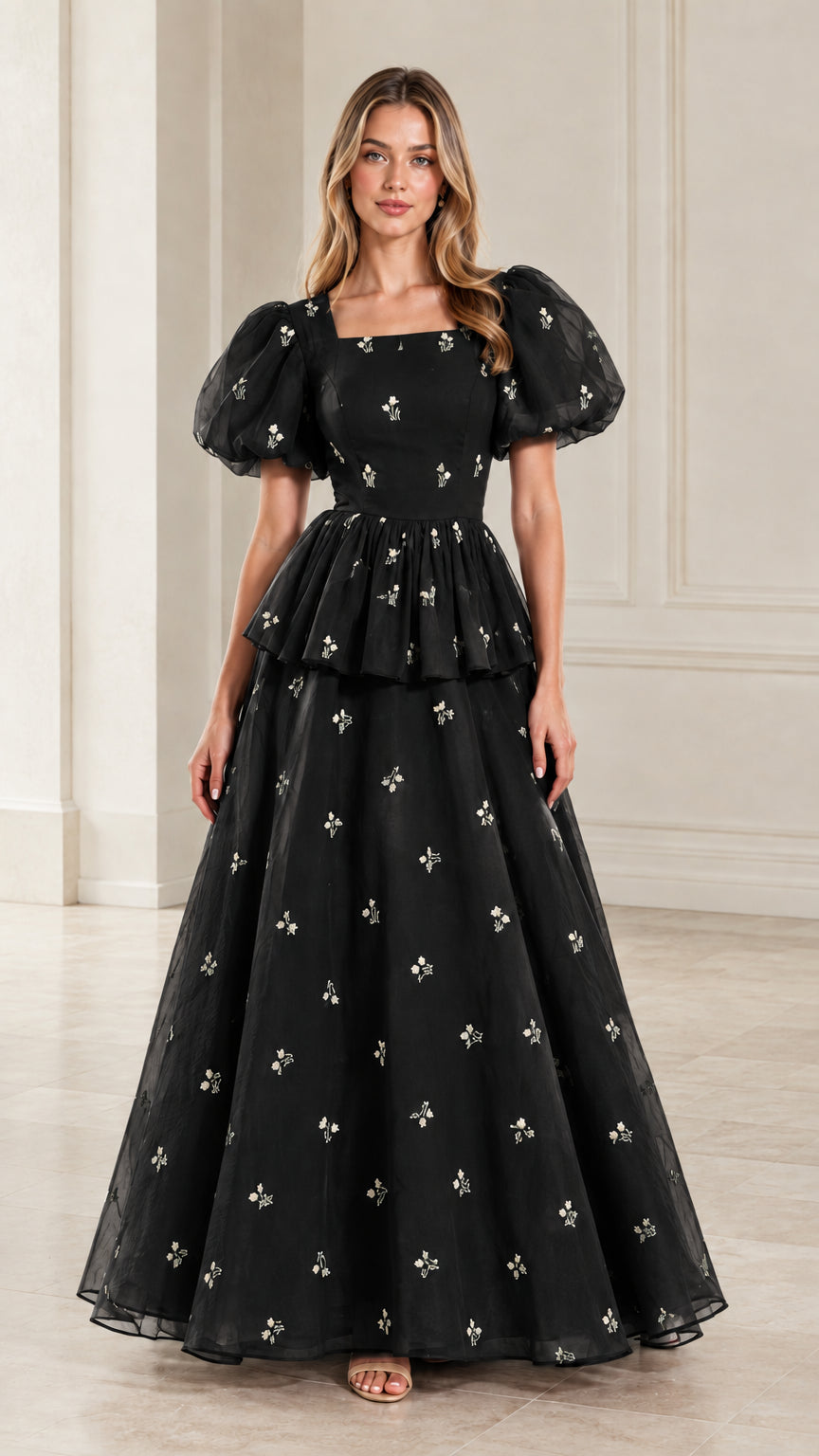 Full-length view of woman wearing classic black embroidered puff sleeve formal gown