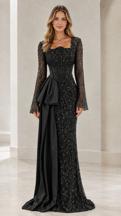 Black beaded long sleeve corset evening dress with matching satin drape
