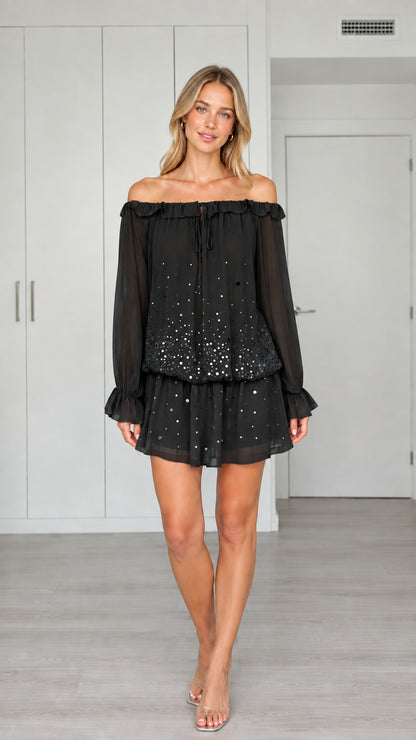 Front view of woman wearing Black off-the-shoulder sequin chiffon mini dress