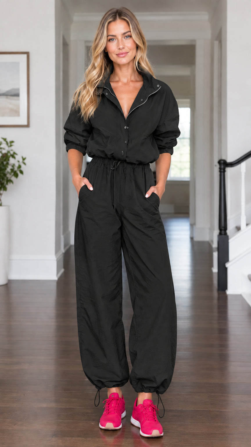 Model wearing black casual long sleeve utility parachute jumpsuit