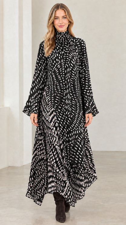 Model wearing black and white abstract print long sleeve high neck maxi dress