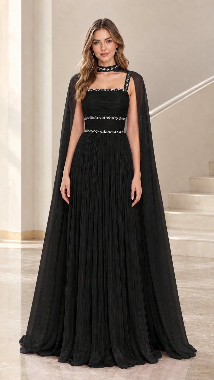 Black chiffon cape evening gown with beaded neckline and waist
