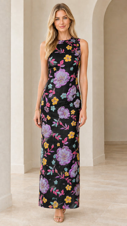 Front view of woman wearing black floral embroidered sleeveless column maxi dress