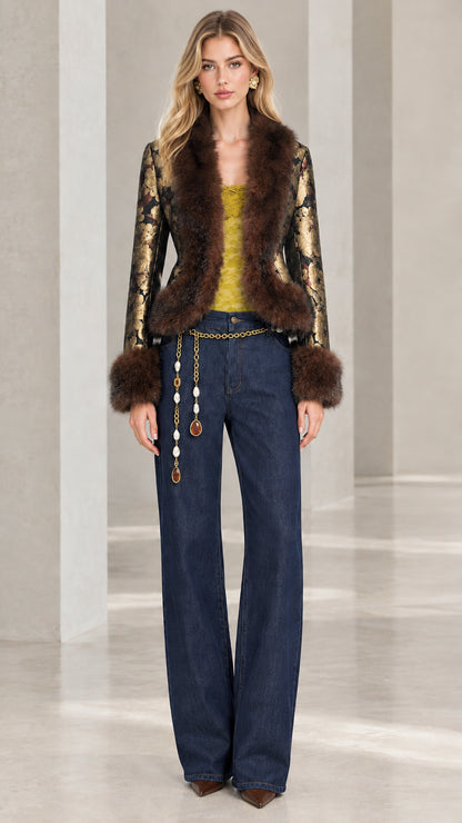 Model wearing black and gold floral jacquard jacket with faux fur trim