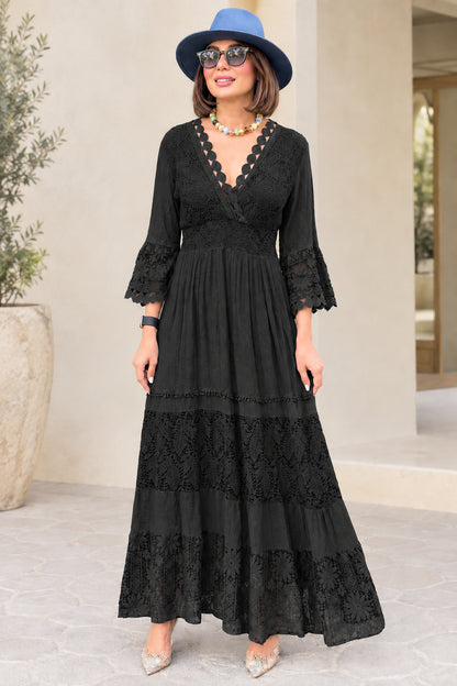 Black lace tiered maxi dress with scalloped V-neckline and 3/4 bell sleeves