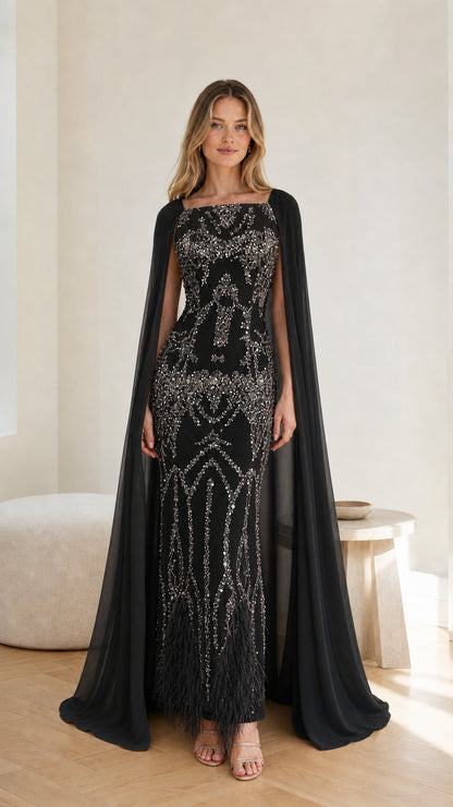 Front view of the Black sequin embroidered cape formal evening gown