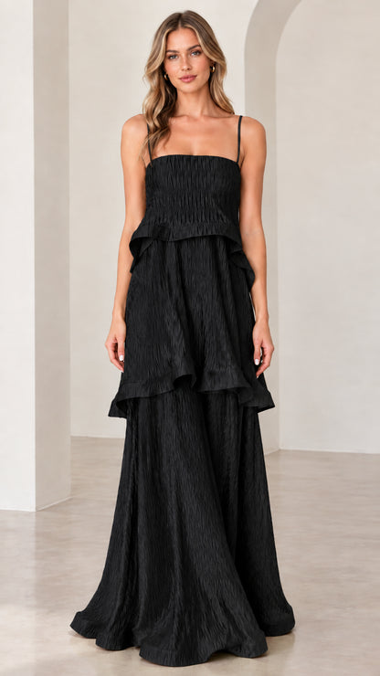 Model wearing black textured tiered sleeveless maxi dress