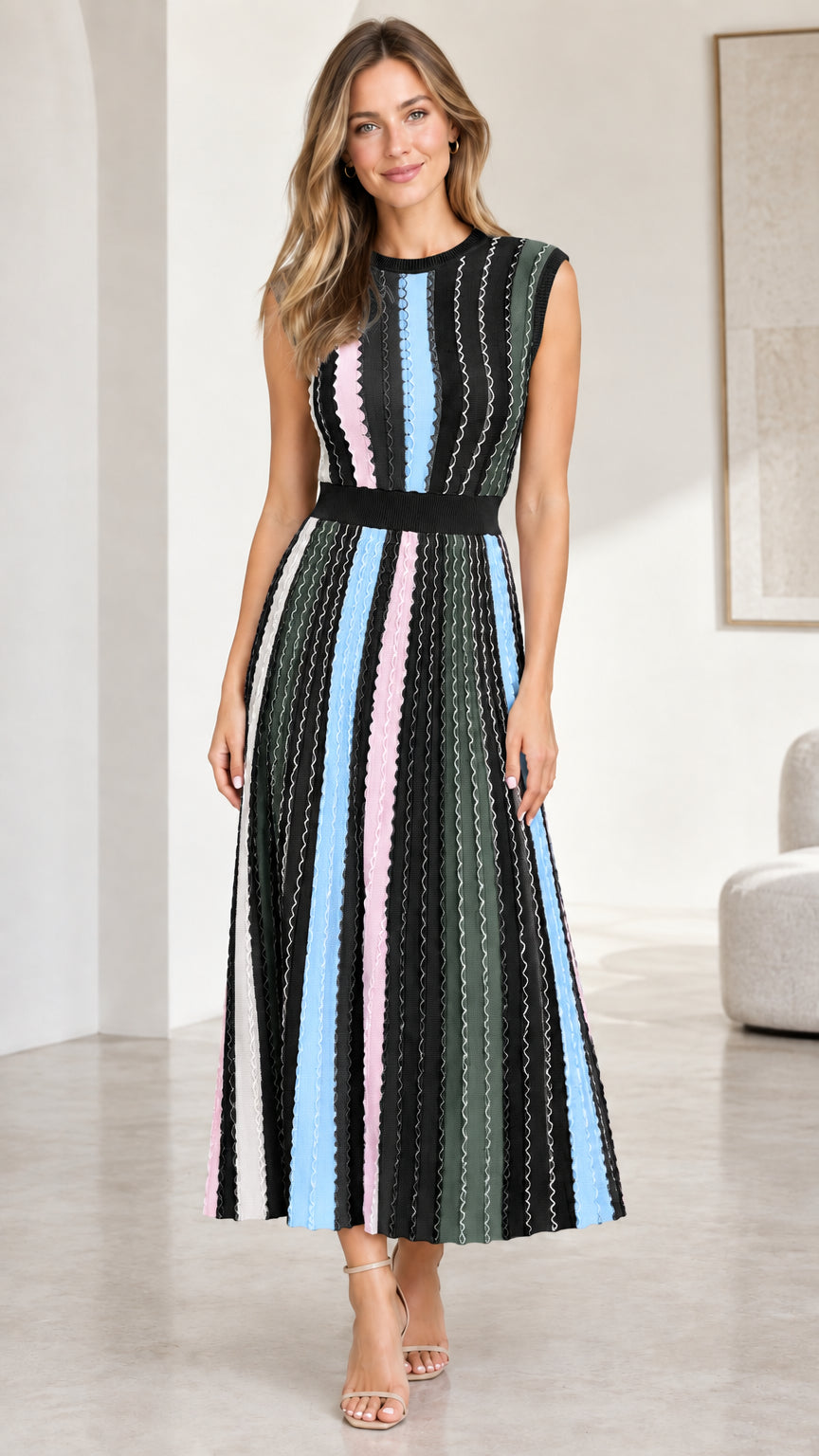 Model wearing black multi sleeveless striped ribbed knit midi dress