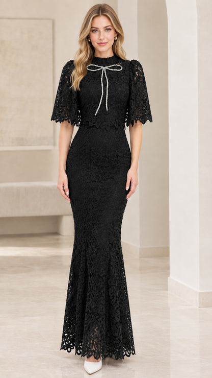 Front view of black lace capelet mermaid maxi evening dress