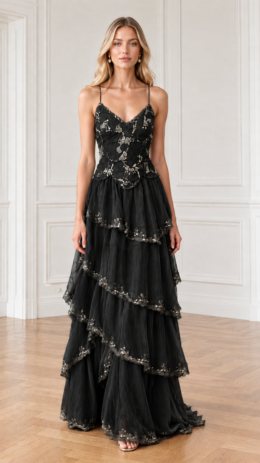 Full-length front view of black embroidered tiered tulle evening dress