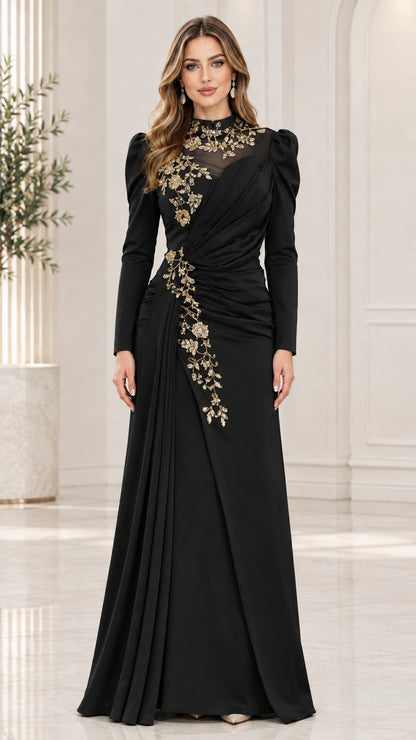 Black long sleeve formal gown with gold floral embroidery and side drape pleating
