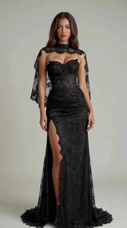 Full-length front view of black lace corset gown with sheer capelet and thigh slit