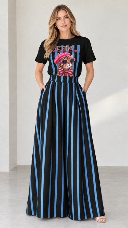 Full-length shot of black graphic tee and black striped wide-leg pants set