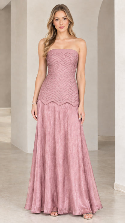 Full-length view of model in dusty rose pink strapless beaded evening gown