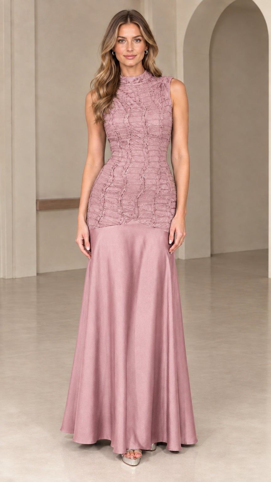 Front view of dusty rose pink high neck drop-waist evening gown