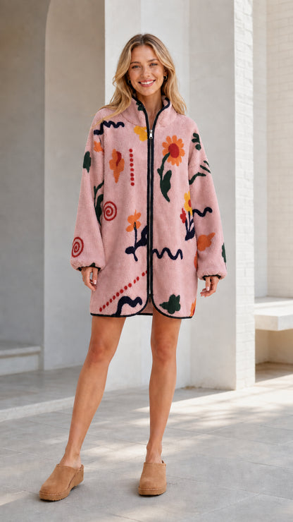 Front view of a pink women's floral printed fleece zip-up jacket