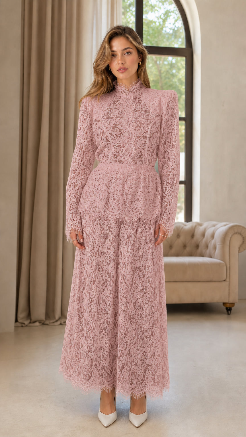 Front full view of woman wearing dusty rose pink lace long sleeve jumpsuit