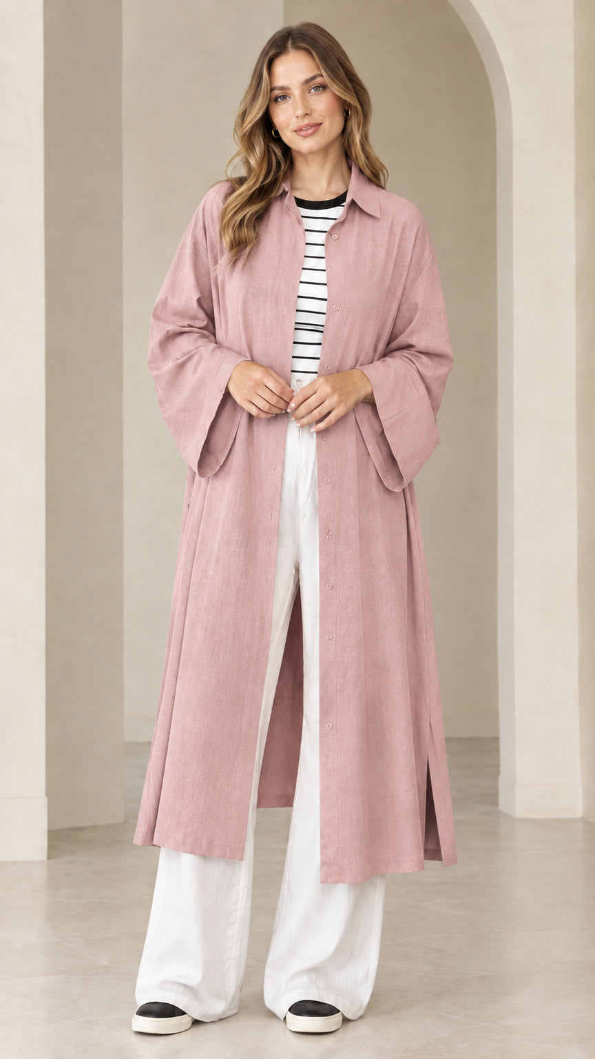 Model wearing dusty pink maxi duster shirt dress paired with casual sneakers