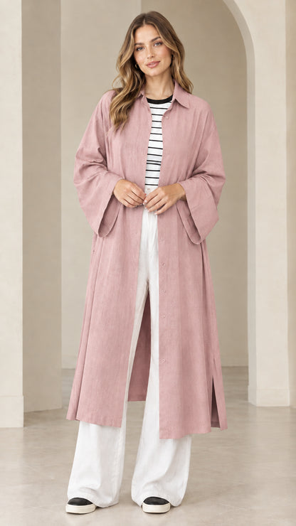 Model wearing dusty pink maxi duster shirt dress paired with casual sneakers